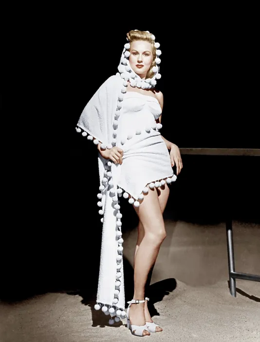 Framed Print : Virginia Mayo models a hooded stole over strapless one-piece bathing suit, 1948 Framed Print : Virginia Mayo models a hooded stole over strapless one-piece bathing suit, 1948
