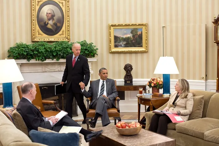 Framed Print : VP Joe Biden and Pres. Obama grip hands as he arrives for a meeting in the Oval Office. Already seated are Sec Framed Print : VP Joe Biden and Pres. Obama grip hands as he arrives for a meeting in the Oval Office. Already seated are Sec