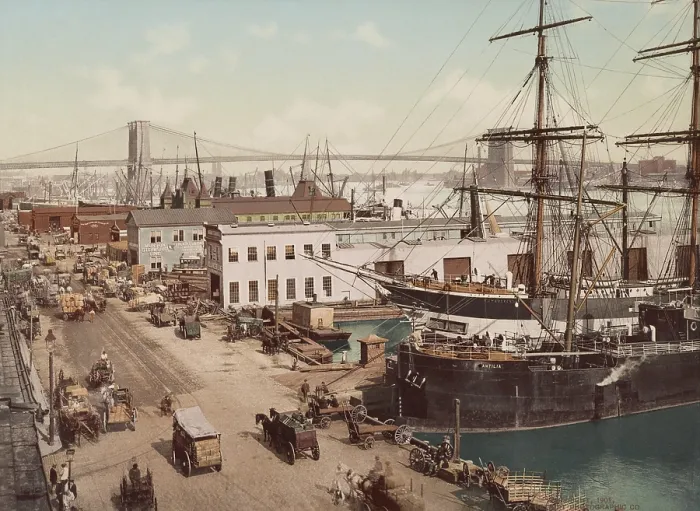 Framed Print : Wagons transport cargo to and from the ships and piers on Manhattan's South Street in 1901. In the background is the Brooklyn Bridge over the East River (BSLOC_2018_2_162) Framed Print : Wagons transport cargo to and from the ships and piers on Manhattan's South Street in 1901. In the background is the Brooklyn Bridge over the East River (BSLOC_2018_2_162)