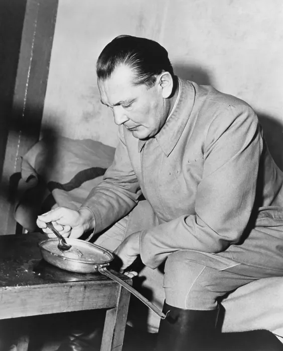 Framed Print : War criminal Hermann Goering eating gruel from a metal pan in prison. He was the highest ranking Nazi to be convicted at the Nuremberg Trials. Nov. 1945-Oct. 1946 Framed Print : War criminal Hermann Goering eating gruel from a metal pan in prison. He was the highest ranking Nazi to be convicted at the Nuremberg Trials. Nov. 1945-Oct. 1946