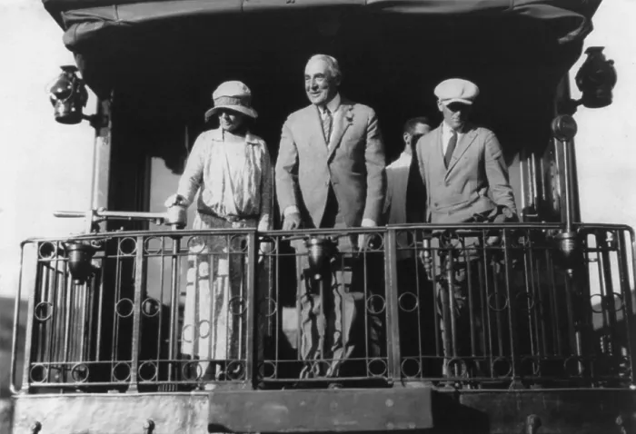 Framed Print : Warren G. Harding (1865-1923), standing on back of Northern Pacific train, with wife Florence and others as they leave Washington, D.C