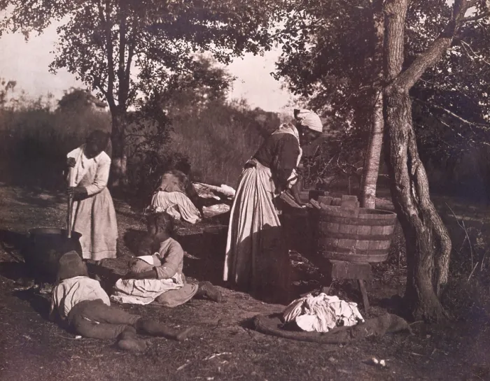 Framed Print : WASH DAY ON THE PLANTATION by Rudolf Eickemeyer, 1887. African Americans doing laundry outdoors in a wash tub, as water is warmed in a cauldron over a fire