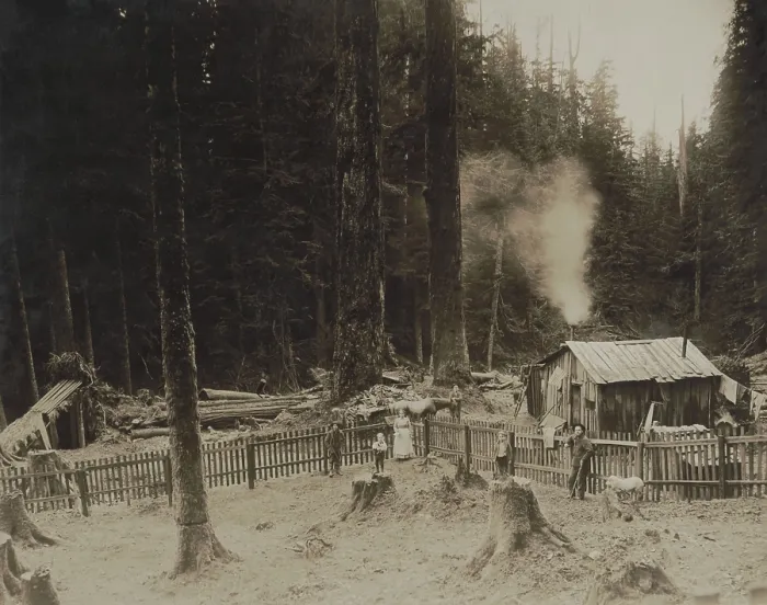 Framed Print : In Washingtons Cascade Mountains, three men, a woman, and two children pose by a small shack. There is a fence enclosed yard and drying laundry Framed Print : In Washingtons Cascade Mountains, three men, a woman, and two children pose by a small shack. There is a fence enclosed yard and drying laundry