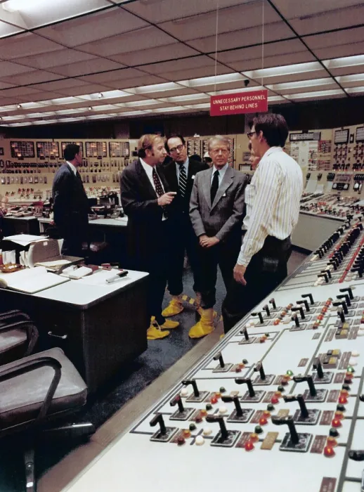 Framed Print : Wearing yellow plastic boots to protect against nuclear contamination President Jimmy Carter visits the Control Room of Three Mile Island Nuclear Generating Station four days