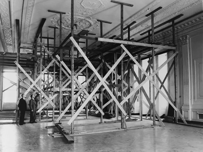 Framed Print : White House architect Lorenzo Winslow and engineer C.W. Barber in the White House East Room. They inspect the sagging ceiling supported by scaffolding. - (BSLOC_2014_15_118)