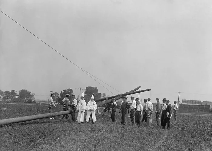 Framed Print : Two white robed Ku Klux Klansmen supervise the erection of 80 ft. cross in Arlington, Virginia. August 8, 1925 at the Arlington horse show grounds. (BSLOC_2015_16_176) Framed Print : Two white robed Ku Klux Klansmen supervise the erection of 80 ft. cross in Arlington, Virginia. August 8, 1925 at the Arlington horse show grounds. (BSLOC_2015_16_176)