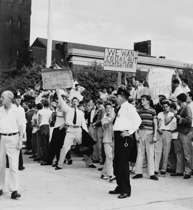 Framed Print : White teen-agers at Baltimore's City Hall in protest against school integration. One of their signs reads, Southern don't want Negroes'. 1955
