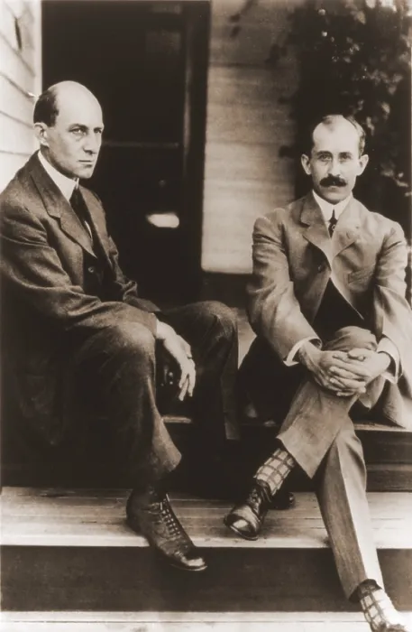 Framed Print : Wilbur Wright and Orville Wright on the porch steps of their house in Dayton Ohio. 1909. LC-USZ62-65478