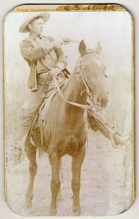 Framed Print : Wild West. Will Roberts, alias Dixon, cowboy train robber, seated on a horse, pointing a gun. Ca 1900