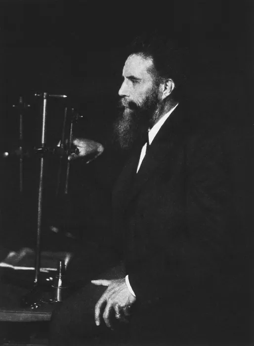 Framed Print : Wilhelm Roentgen (1845-1923), German physicist, discoverer of X-rays, standing beside one of his machines. Photogravure, ca. 1895