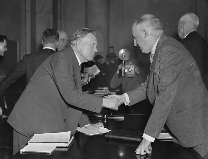 Framed Print : William Borah greets former Brain Truster Raymond Moley. Mar. 23, 1937. Moley joined Borah and the Republicans in opposition to FDR's court packing scheme