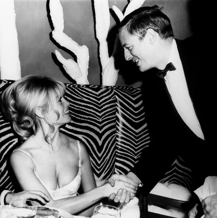 Framed Print : William Buckley Jr. is obviously delighted as he shakes hands with Brigitte Bardot