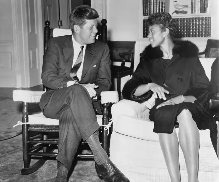 Framed Print : Wilma Rudolph (1940-1994) chats with President Kennedy at the White House. She was the first African American women to win three gold medals at one Olympic games in 1960