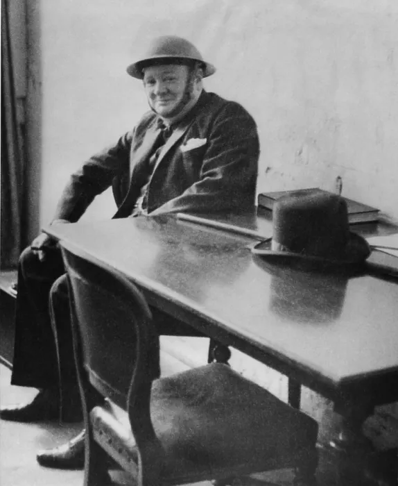 Framed Print : Winston Churchill (1874-1965), wearing a steel helmet during his visit to Dover and Ramsgate air raid damaged areas in September 1940. His derby hat sits on the table