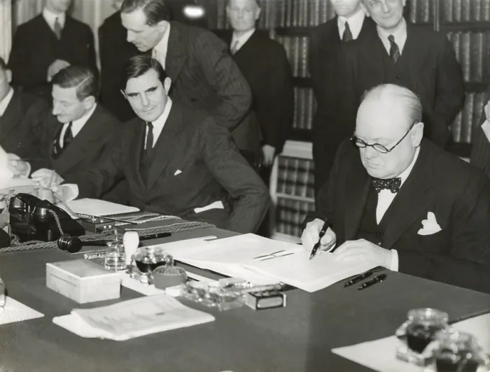 Framed Print : Winston Churchill signing the Lend Lease agreement to lease British bases to the U.S. March 11, 1941. From his desk at 10 Downing Street, Churchill and U.S Framed Print : Winston Churchill signing the Lend Lease agreement to lease British bases to the U.S. March 11, 1941. From his desk at 10 Downing Street, Churchill and U.S