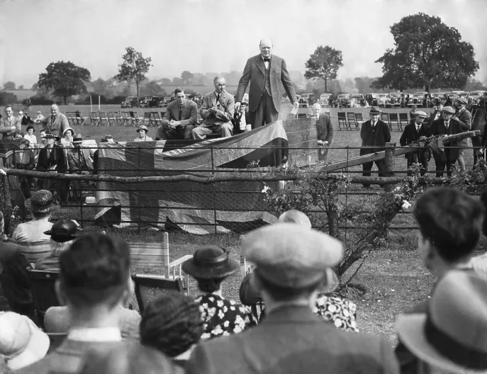 Framed Print : Winston Churchill speaking at Theydon Bois, Essex, Aug. 27, 1938. Churchill said that the gigantic German Army was a danger to World peace. - (BSLOC_2014_17_31) Framed Print : Winston Churchill speaking at Theydon Bois, Essex, Aug. 27, 1938. Churchill said that the gigantic German Army was a danger to World peace. - (BSLOC_2014_17_31)