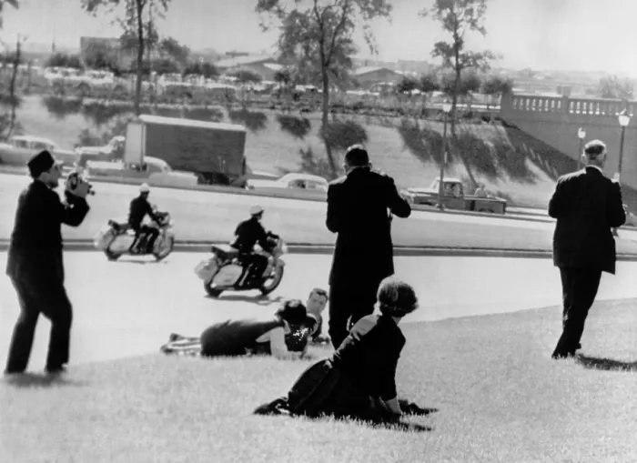 Framed Print : Witnesses to the Kennedy assassination. Frightened spectators hug the ground moments after a sniper's bullet struck President John Kennedy Framed Print : Witnesses to the Kennedy assassination. Frightened spectators hug the ground moments after a sniper's bullet struck President John Kennedy