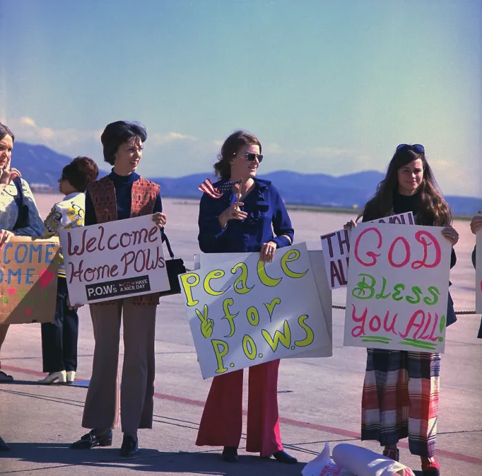 Framed Print : Wives welcome home US Marine POWs. Marine wives wait with signs for their husbands who were released in Hanoi, North Vietnam, on Feb. 12, 1973
