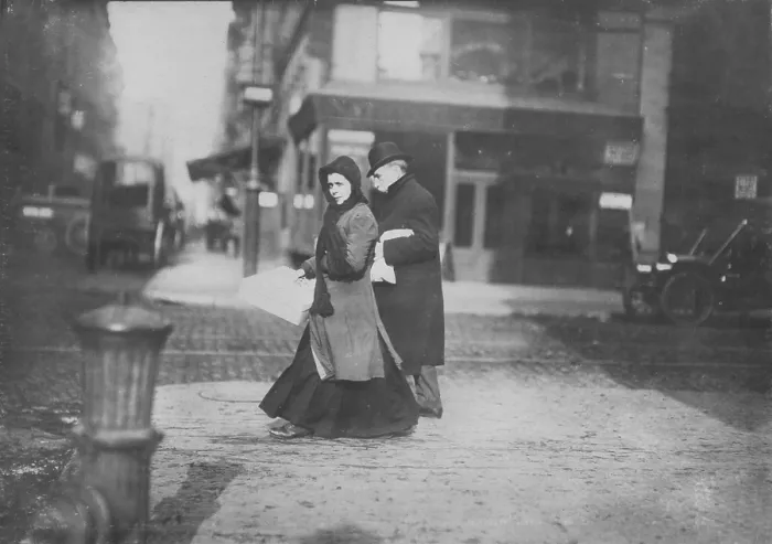 Framed Print : Woman carrying flowers home, West Houston Street, original caption: A short time ago she told me they were not going to make flowers any more, New York