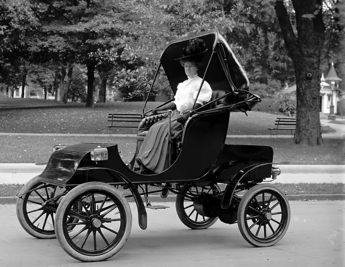 Framed Print : Woman driving electric car ca. 1910s