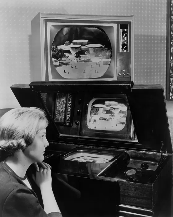 Framed Print : Woman looking at two television sets Framed Print : Woman looking at two television sets