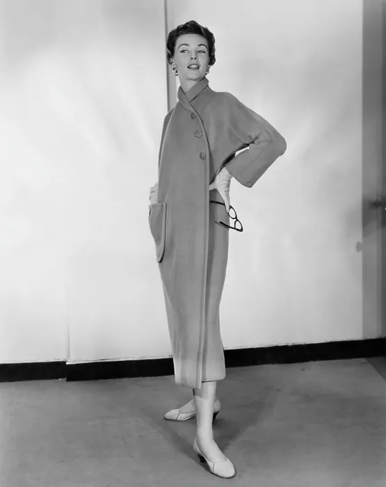 Framed Print : A woman models a camel fleece coat designed by Claire McCardell, circa 1953. Courtesy: CSU Archives / Everett Collection