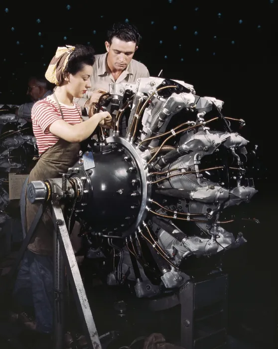 Framed Print : Woman war worker in training as an engine mechanic at Douglas Aircraft Company. Long Beach, California during World War 2, ca. 1942-45. (BSLOC_2013_14_118)