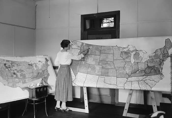 Framed Print : Women applying color to a large detailed map of the continental United States. Aug. 12, 1922
