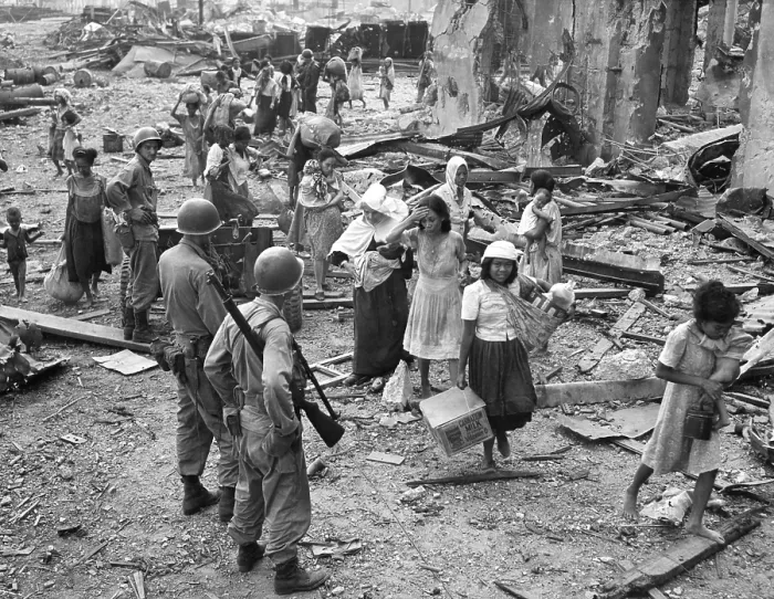 Framed Print : Women and children picking their way barefooted over the wreckage of North Manila, ca. Feb. 23, 1945