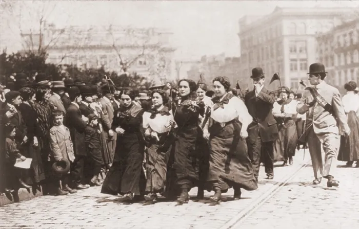 Framed Print : Four women marching arm-in-arm in the 1910 May Day Parade in New York City's Union Square