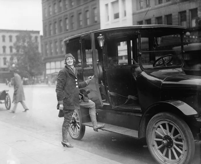Framed Print : Women taxi driver, dressed in special driving costume, in Washington, D.C. in 1919 Framed Print : Women taxi driver, dressed in special driving costume, in Washington, D.C. in 1919