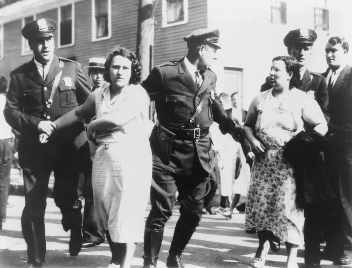 Framed Print : Women textile workers arrested by policemen for picketing the Jackson mill in Nashua, New Hampshire. Sept. 7, 1934