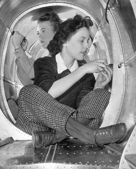 Framed Print : Two women workers in a cramped aircraft space at Grumman Aircraft Engineering Corp. During World War 2, ca. 1942-45. (BSLOC_2013_14_122) Framed Print : Two women workers in a cramped aircraft space at Grumman Aircraft Engineering Corp. During World War 2, ca. 1942-45. (BSLOC_2013_14_122)
