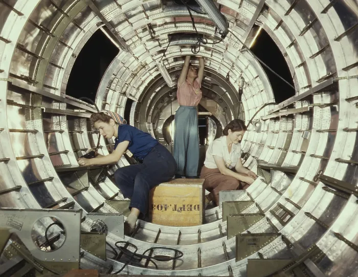 Framed Print : Women workers install fixtures and assemblies to a tail fuselage section of a B-17 bomber. Douglas Aircraft Company plant, Long Beach, California, during World War 2, Oct. 1942