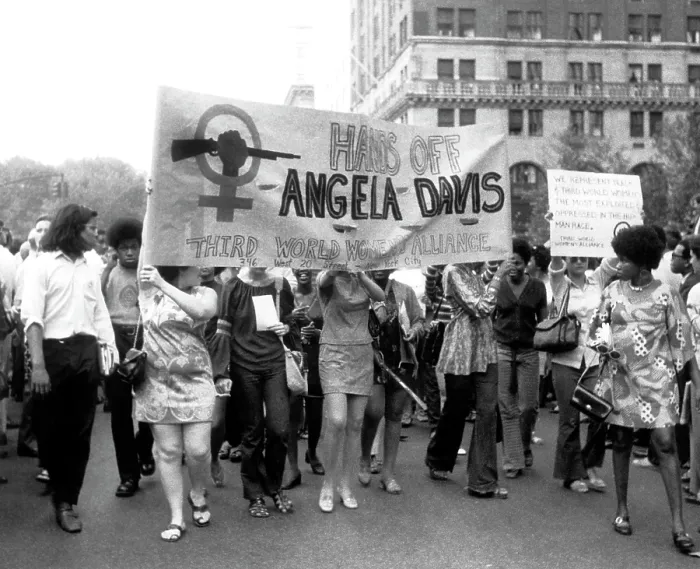 Framed Print : Women's Liberation marchers carrying a banner in support of fugitive black militant Angela Davis, New York City, 08-26-1970. Courtesy: CSU Archives  /  Everett Collection