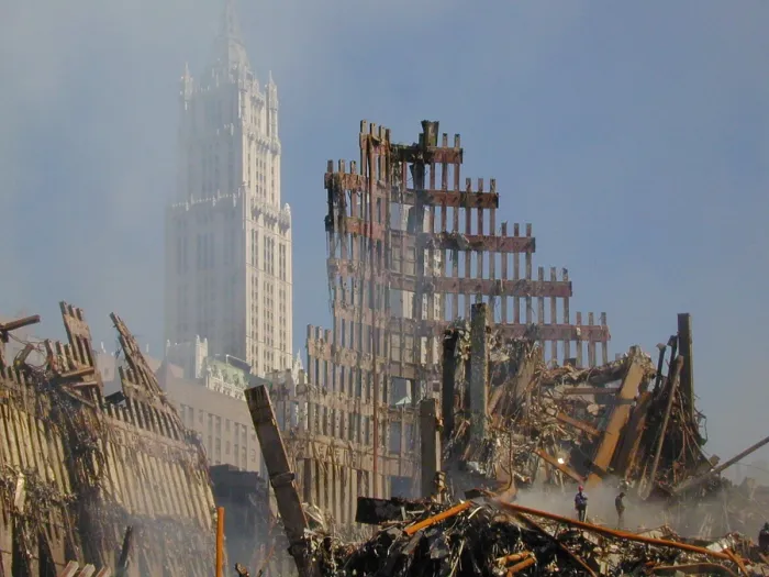 Framed Print : Woolworth Building rises behind the rubble of the collapsed North Tower of the WTC, Sept. 16, 2001. World Trade Center, New York City, after September 11, 2001 terrorist attacks