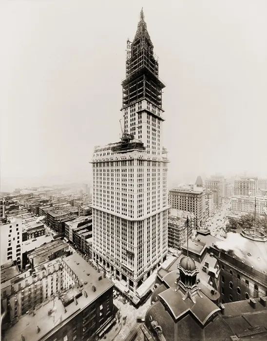 Framed Print : Woolworth Building during the last stages of exterior construction. The tower takes shape and most of the building exterior is faced with white terra cotta. July 1, 1912