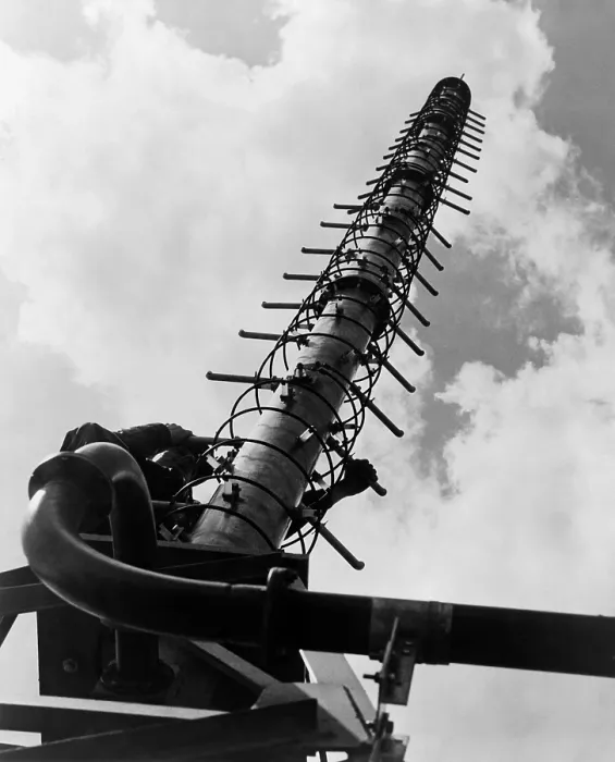 Framed Print : Worker climbing a Helical television antenna developed by General Electric engineers in 1951 Framed Print : Worker climbing a Helical television antenna developed by General Electric engineers in 1951