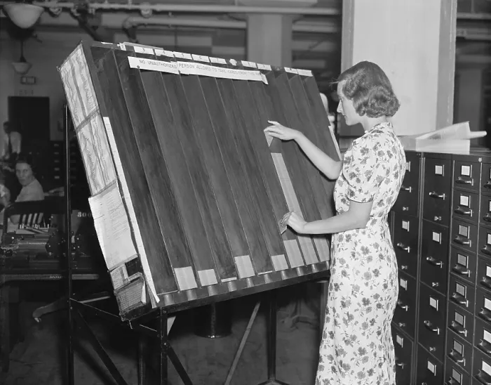 Framed Print : A worker in the Social Security Board Records Office at the visible control rack