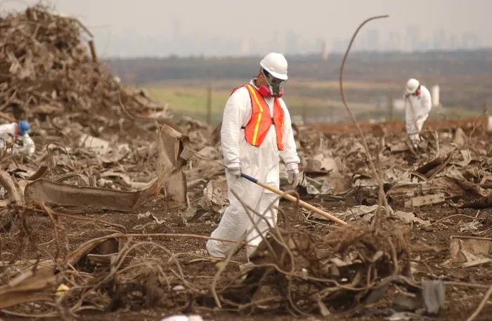 Framed Print : Workers at the Fresh Kills Landfill gather debris from the World Trade Center for victim identification and evidence related to the attack. Oct. 16 2001. Photo: Everett Collection