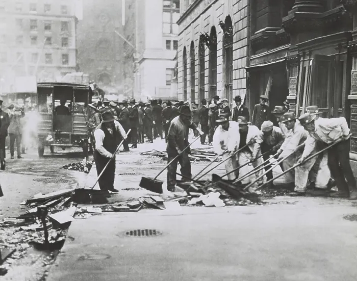 Framed Print : Workers sweeping up rubble and broken glass following Wall St. Bombing of Sept. 16, 1920