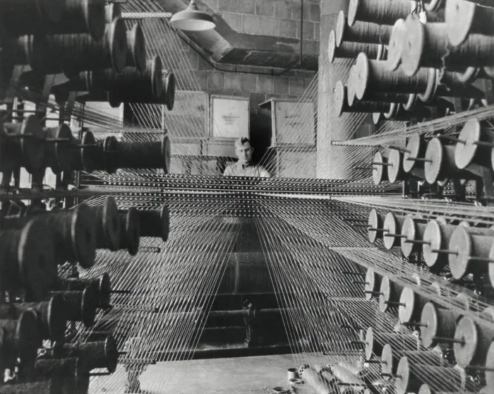 Framed Print : Workman operating an industrial loom strung with hundreds of wool threads. Chicago's Olsen Rug Company. Ca. 1950. (BSLOC_2014_13_232) Framed Print : Workman operating an industrial loom strung with hundreds of wool threads. Chicago's Olsen Rug Company. Ca. 1950. (BSLOC_2014_13_232)