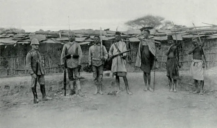 Framed Print : World War 1 in Africa. The transformation the German Askaris (native soldiers). At right are three natives with their traditional weapons