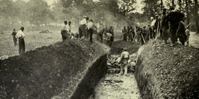 Framed Print : World War 1. After a battle in Northern France, three hundred Germans were buried in one great trench and a similar number of French in another. 1914