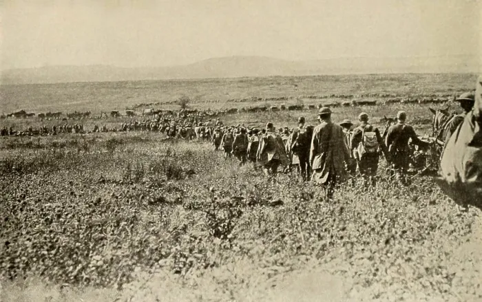 Framed Print : World War 1: Battle of St. Mihiel. In fields near Montsec, France, an American machine gun company passes through a regiment of doughboys. A supply train is in the background Framed Print : World War 1: Battle of St. Mihiel. In fields near Montsec, France, an American machine gun company passes through a regiment of doughboys. A supply train is in the background