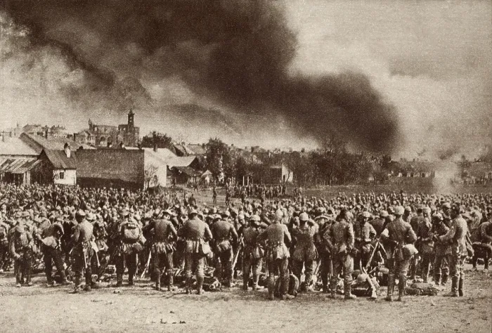 Framed Print : World War 1. German troops gathered after driving the Russians from Garlice, Galicia. The smoke is from the town that was put to the torch by the Germans. 1915