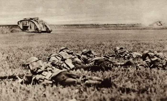 Framed Print : World War 1. Platoon of the American 107th infantry, lying low behind an advancing tank, ready to attack as soon as the tank has battered down the enemy defenses Framed Print : World War 1. Platoon of the American 107th infantry, lying low behind an advancing tank, ready to attack as soon as the tank has battered down the enemy defenses