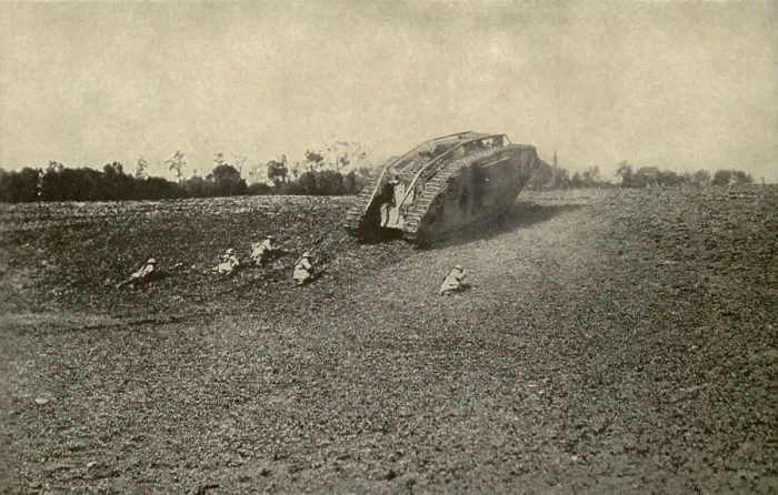 Framed Print : World War 1 Tanks. U.S. soldiers (107th Infantry, 27th Division) advancing toward the Hindenburg Line from behind the shelter of a British tank. 1918. (BSLOC_2013_1_155)