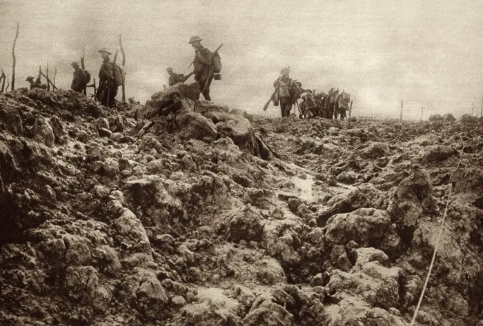 Framed Print : World War 1. Western front battleground has been churned up by shell explosions so that it bears no resemblance to its peacetime appearance. Allied soldiers are in the background Framed Print : World War 1. Western front battleground has been churned up by shell explosions so that it bears no resemblance to its peacetime appearance. Allied soldiers are in the background