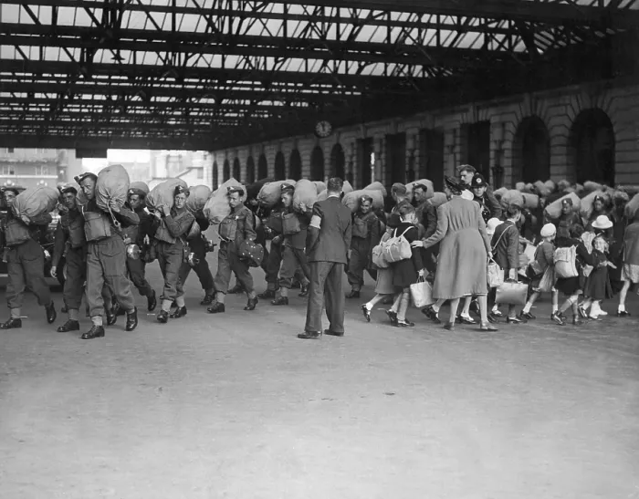 Framed Print : World War 2, Battle of Britain. Going in opposite directions, troops arrive in a London railroad station, as children are evacuated to the safer countryside. Ca. 1940 Framed Print : World War 2, Battle of Britain. Going in opposite directions, troops arrive in a London railroad station, as children are evacuated to the safer countryside. Ca. 1940